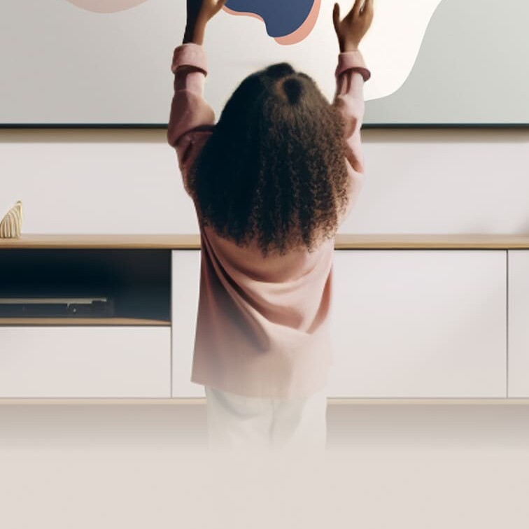 Young girl interacting with a digital interactive assistant in a living room