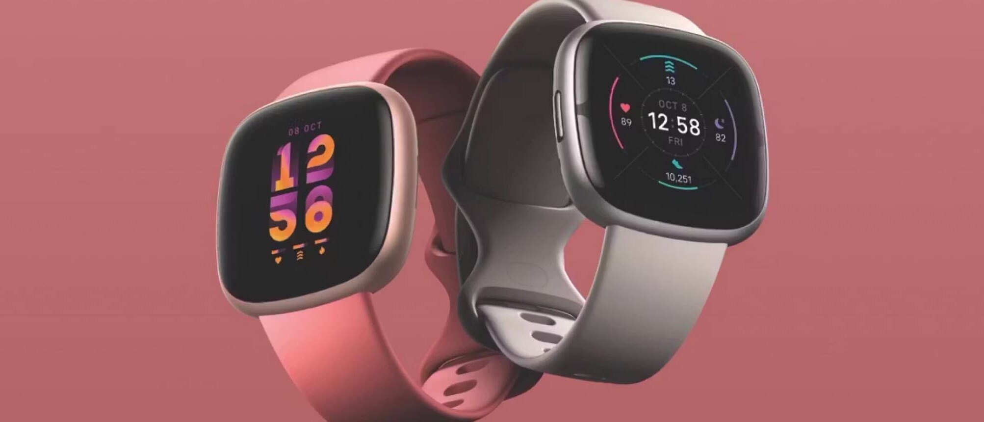 A pair of modern Fitbit watches displaying modern interfaces.
