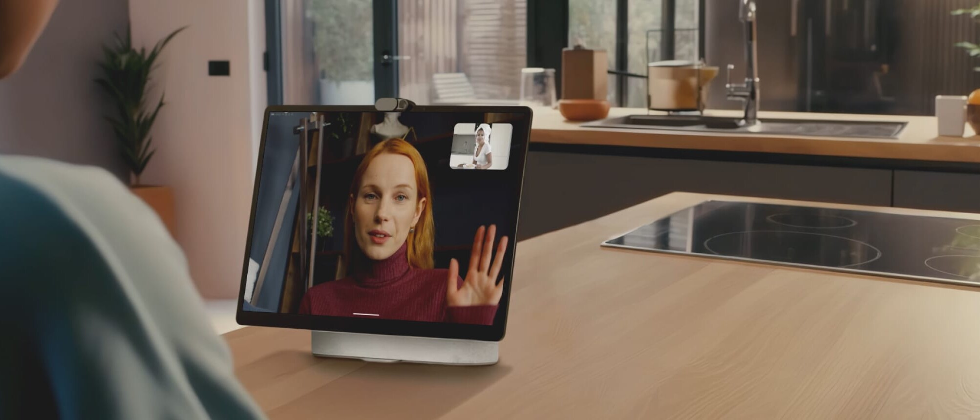 A remote employee takes a conference call on their tablet.